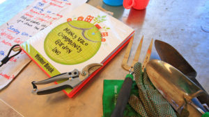 Manly Vale Community Garden visitor book and garden tools