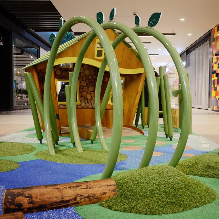 Play tunnel structure and grass mounds